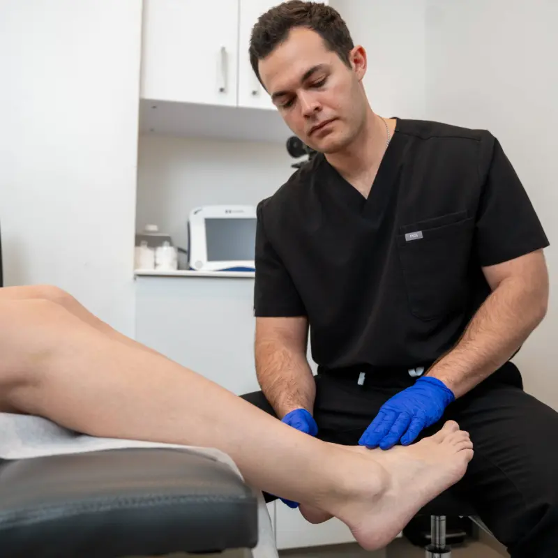 Dr. Shaun Cole performing a leg ultrasound evaluation on a patient at Vein Clinics NY in Astoria, New York.